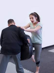 Young Woman Practicing Self-Defense at National Karate Schools
