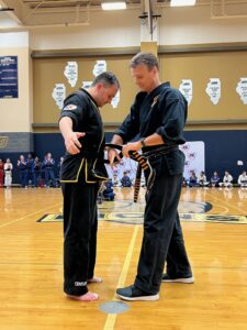 Master Nelson awarding 6th Degree Black Belt to the adult Master Drescher